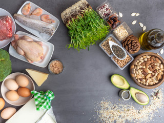 Fototapeta na wymiar High protein food - meat, fish, poultry, nuts, dairy products, eggs, micro greens, beans, avocado, oil, oat, seeds Products goof for healthy hair.
