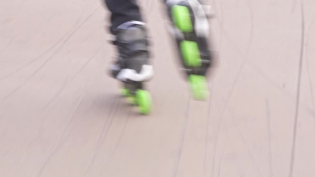 Close Up of inline skates with green wheels