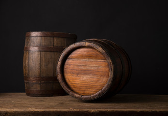 Old wooden barrel on a brown background