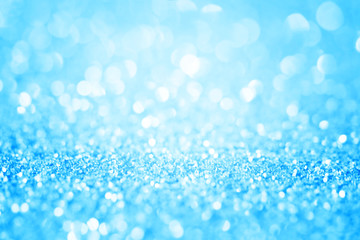 Blue glitter abstract background with bokeh defocused. Macro shot.