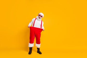 Fototapeta na wymiar Full size photo of crazy santa claus lose weight show little abdomen perfect x-mas christmas celebration dieting wear hat black boots isolated bright color background