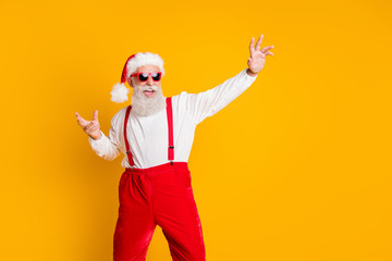 Fototapeta na wymiar Portrait of crazy funny santa claus clubber in red hat cap enjoy noel x-mas tradition party celebration dance wear shirt suspenders isolated over shine color background