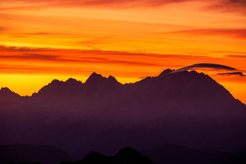 The julians alps mountain range during sunrise and sunset with the epic mountains and colour in...
