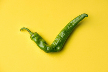 Ugly products, vegetables on a colored yellow background. Pepper. Consent. Okay Check mark organic.