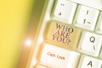 Writing note showing Who Are You Question. Business concept for Identify yourself description...