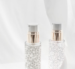 Skincare serum and make-up primer gel bottle, moisturizing lotion and lifting cream emulsion,...