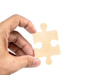 hand hold the jigsaw puzzle concept of missing something
