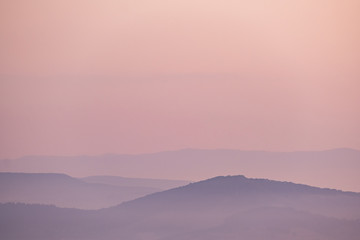 Minimalistic landscape with mountains in pink colors