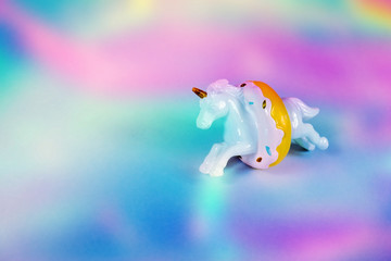 Unicorn horse jumping through a donut