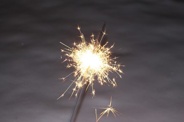 burning sparkler on New Year's Eve night