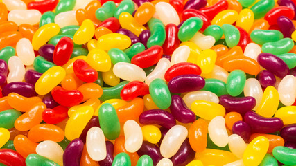 Colorful jelly beans isolated on white.