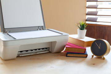 White scanner or printer machine on a table close up