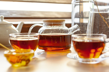 Close up of glass tea cup with honey