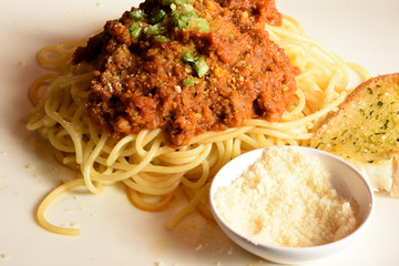 Spaghetti and bread on a plate