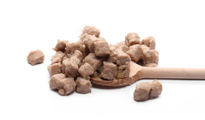 Dog, cat food pile with wooden spoon isolated on white background