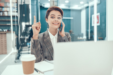 Happy woman thinking of great idea stock photo