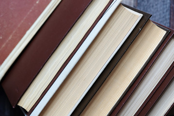 A stack of old books close-up. Educational background