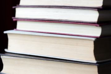 A stack of old books close-up. Educational background