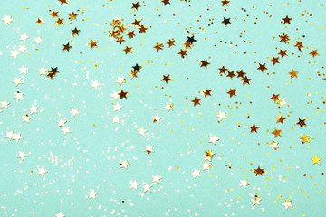 Trendy mint background with golden stars. The concept of celebrations, the Day of St. Valentine,...