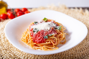 Spaghetti with tomato sauce and grana padano cheese. Classic dish of Italian tradition. Healthy eating, italian food