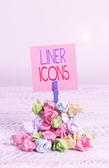 Writing note showing Liner Icons. Business concept for use to improve visual interest and grab the user s is attention Reminder pile colored crumpled paper clothespin wooden space