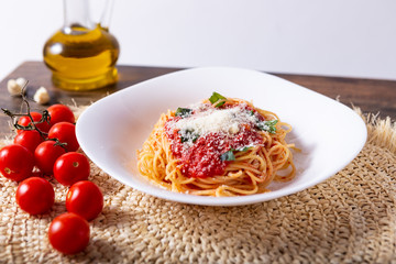 Spaghetti with tomato sauce and grana padano cheese. Classic dish of Italian tradition. Healthy eating, italian food