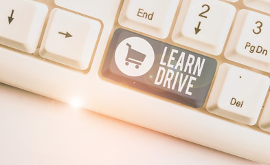 Writing note showing Learn Drive. Business concept for to gain the knowledge or skill in driving a...