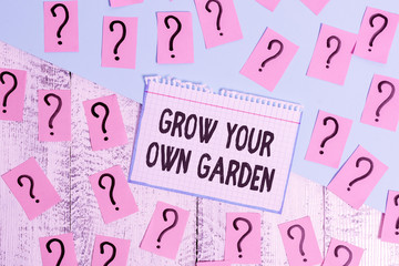 Writing note showing Grow Your Own Garden. Business concept for Organic Gardening collect demonstratingal vegetables fruits Scribbled and crumbling papers with thick cardboard above wooden table