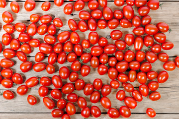 chery tomatoes on wooden board