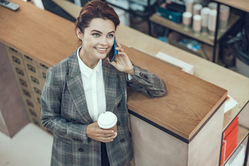 Happy stylish woman with coffee smiling stock photo