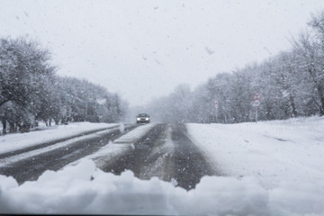 Turn on a snowy road with poor visibility
