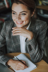 Dreamy author thinking of her new book stock photo