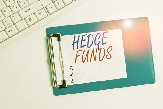 Word writing text Hedge Funds. Business photo showcasing basically a fancy name for an alternative investment partnership Flat lay above table with pc keyboard and copy space note paper