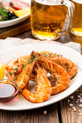 Beer with appetizers red fish and shrimp