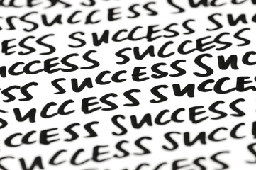 Success message written as a motivational mantra in black ink on white
