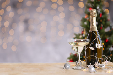 Beautiful christmas composition with two glasses of sparkling wine, decorations on textured table....