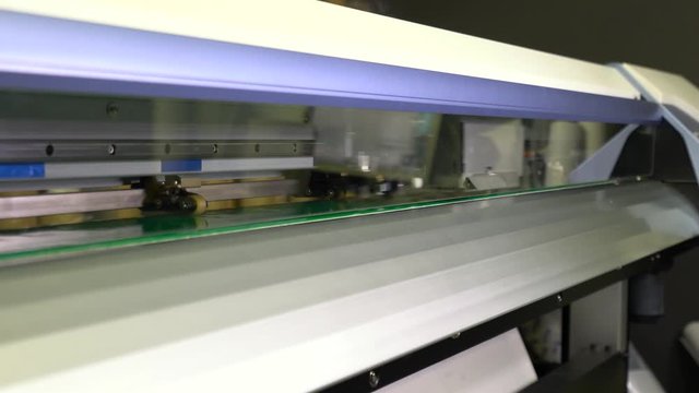 Wide-format inkjet printer in action 