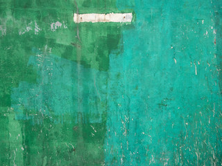 grungy green painted cement wall