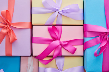 flat lay with multicolored gift boxes with ribbons and bows