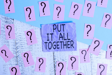 Text sign showing Put It All Together. Business photo showcasing Join Collectively Unified Integrated Linked Merge Scribbled and crumbling papers with thick cardboard above wooden table