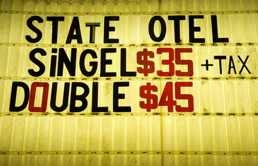 Quirky sign from an American roadway motel includes prices and some misspellings