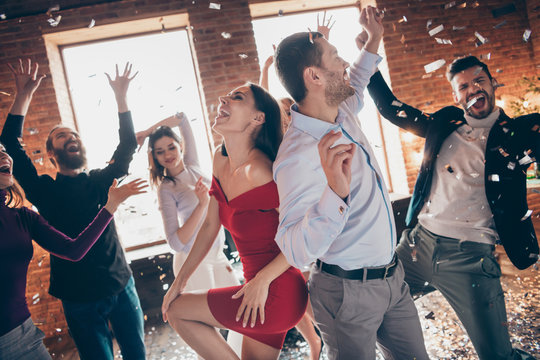 Profile photo of group friends dance floor spending x-mas party together couple dancing back-to-back excited favorite song confetti air wear formalwear dress shirts indoors