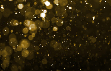 gold powder bokeh light, blur circles on black background