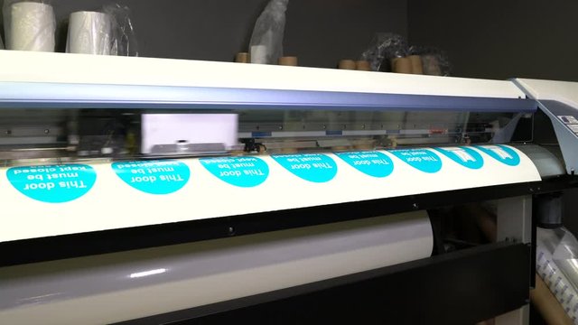 Wide-format inkjet printer in action 