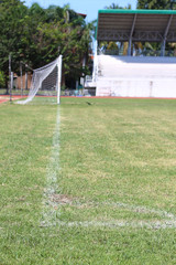 Fototapeta premium White line of corner on the green soccer field.