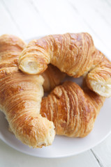 Casual pile of freshly baked authentic French croissants from a traditional bakery in Paris, France