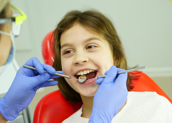 Dental treatment for a child in the dentist’s office.