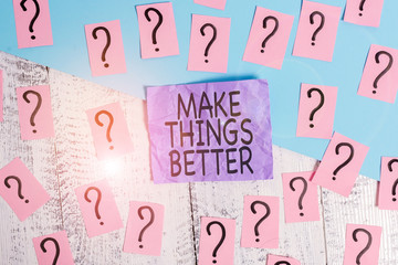 Text sign showing Make Things Better. Business photo showcasing Do something to Improve oneself Be the Change Act Scribbled and crumbling papers with thick cardboard above wooden table