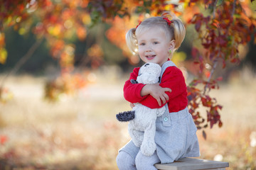 Little fashionista. Happy girl on autumn day. Little girl happy smiling with autumn leaves. Girls autumn style. Stylish by nature.Little girl excited about autumn season. Autumn warm season