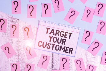Obraz premium Writing note showing Target Your Customer. Business concept for Tailor Marketing Pitch Defining Potential Consumers Scribbled and crumbling papers with thick cardboard above wooden table